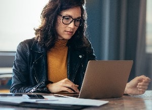 woman looking at laptop