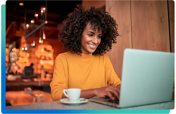 Woman smiling while using laptop