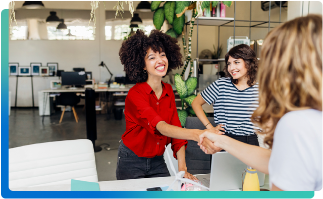 Two women shaking hands