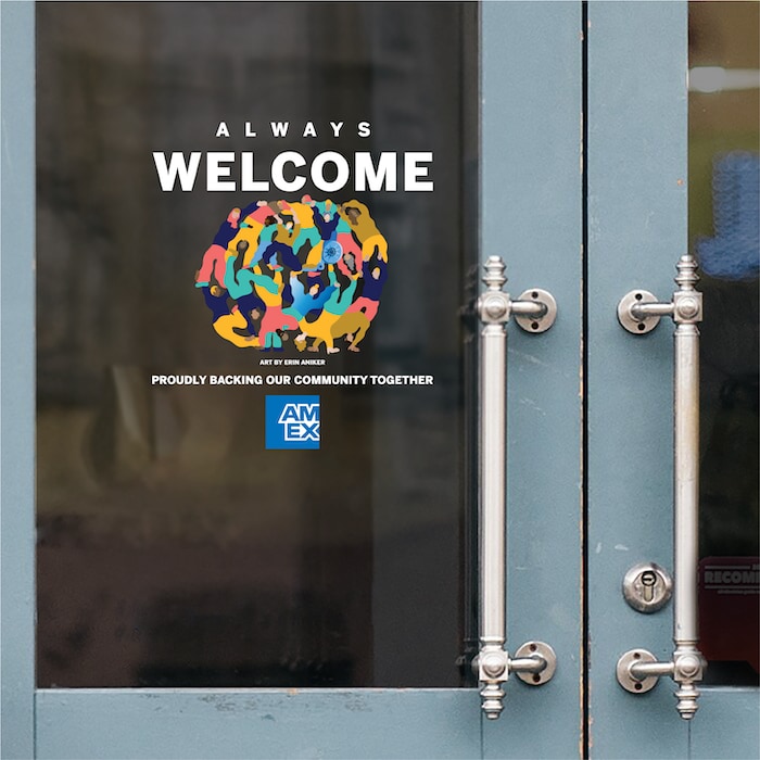 Artist Series Artwork in storefront window that says Always Welcome