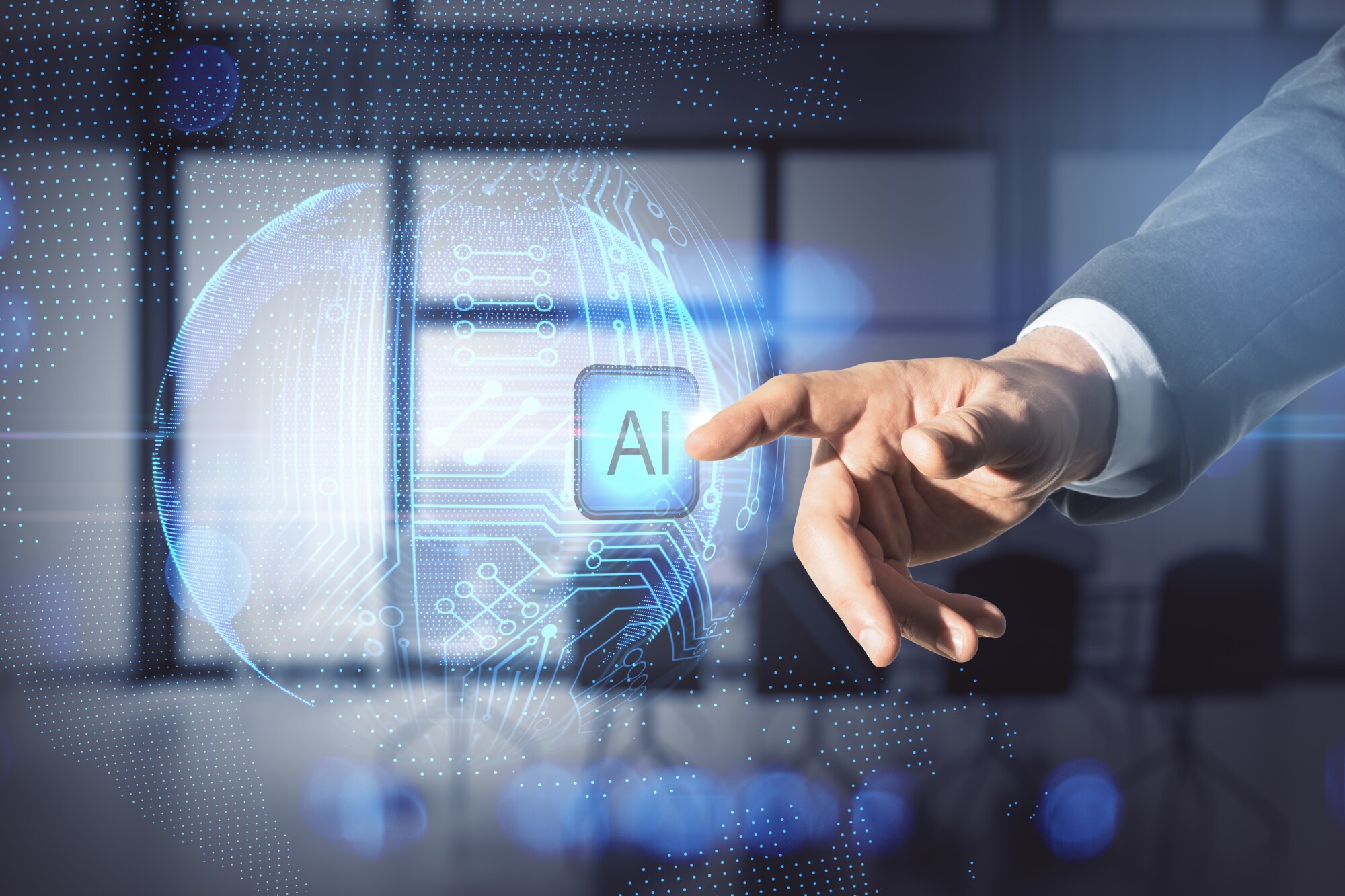 Fotomontage einer Hand, die auf eine Computergrafik mit einem AI-Icon zeigt.