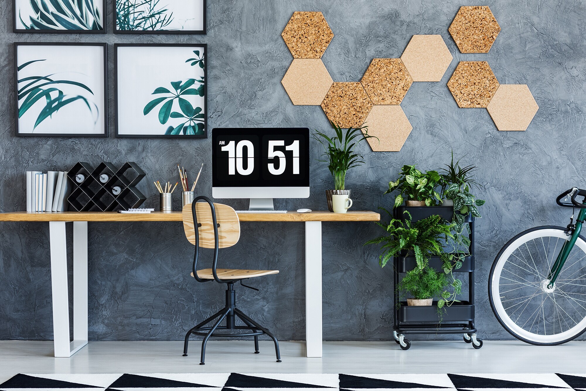 Wood and metal chair standing by the desk in living room with workspace
