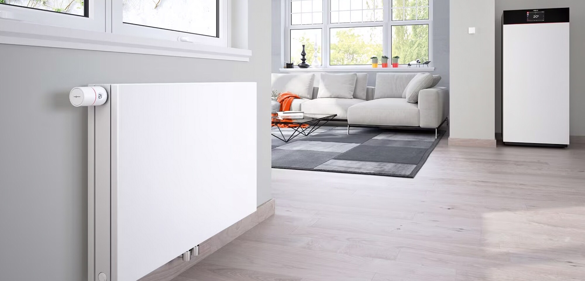 Viessmann: Ein Jahrhundert voller Innovationen Heizkörper in einem modern eingerichteten Wohnzimmer.