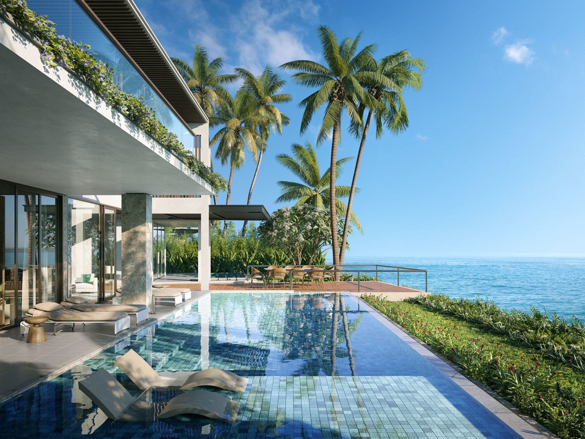 Terrasse einer luxuriösen Hotelsuite mit Swimmingpool und Palmen am Meer.