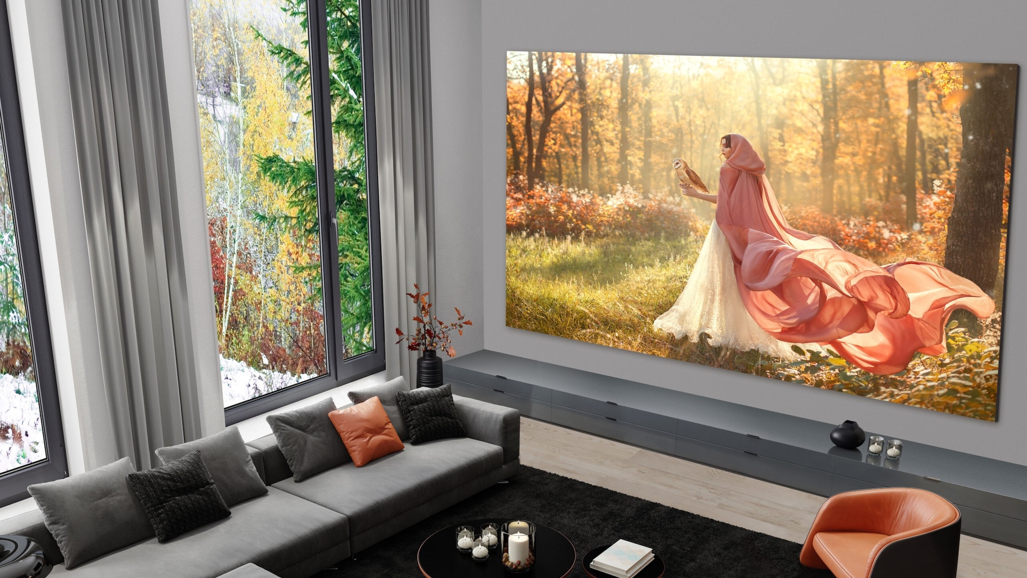 LG Fernseher Ein flächenfüllender LED-Fenseher an der Wand in einem Wohnzimmer mit hohen Wänden und Panoramafenster.