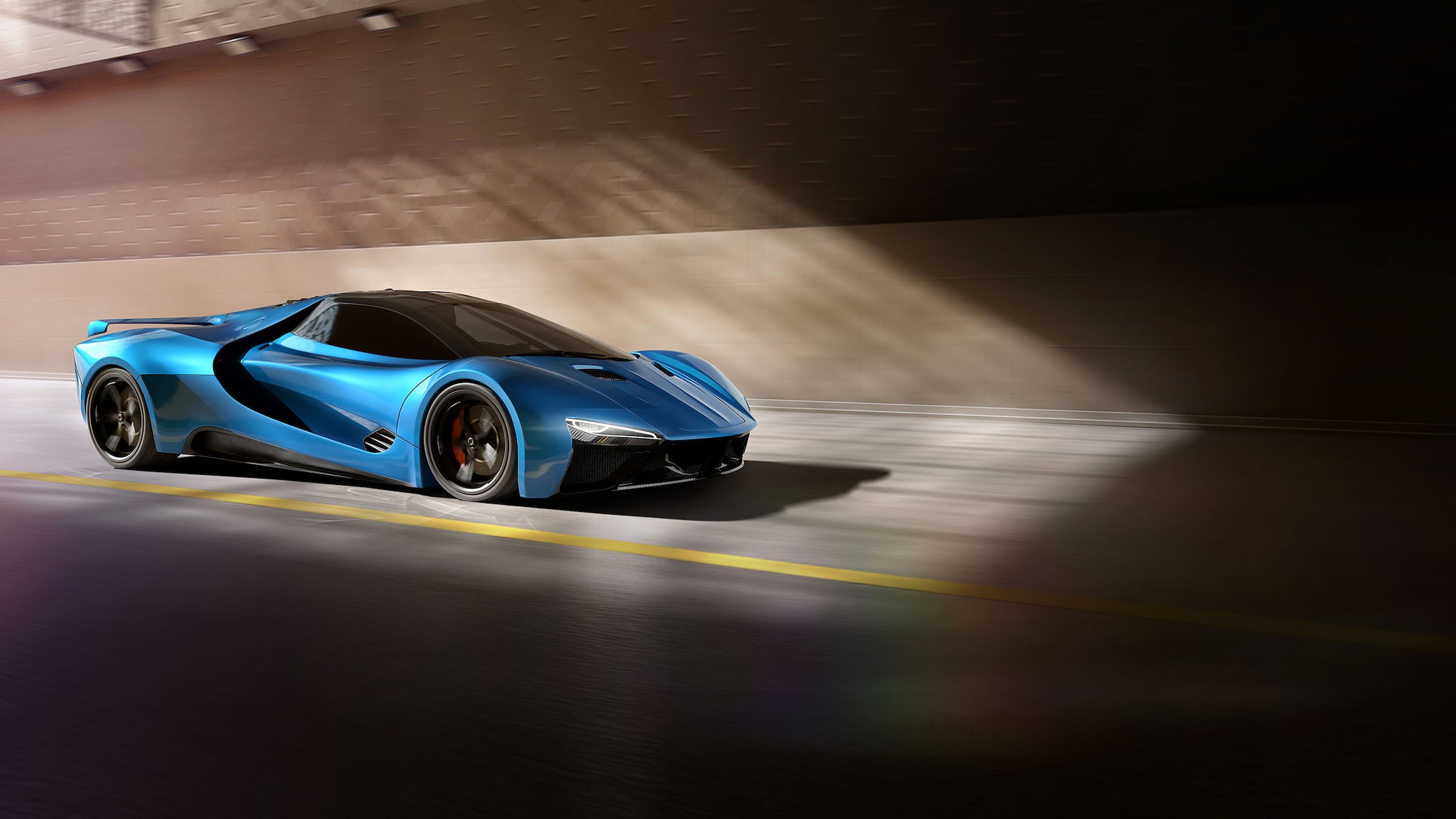 Ein blauer Sportwagen fährt auf einer Rennstrecke.