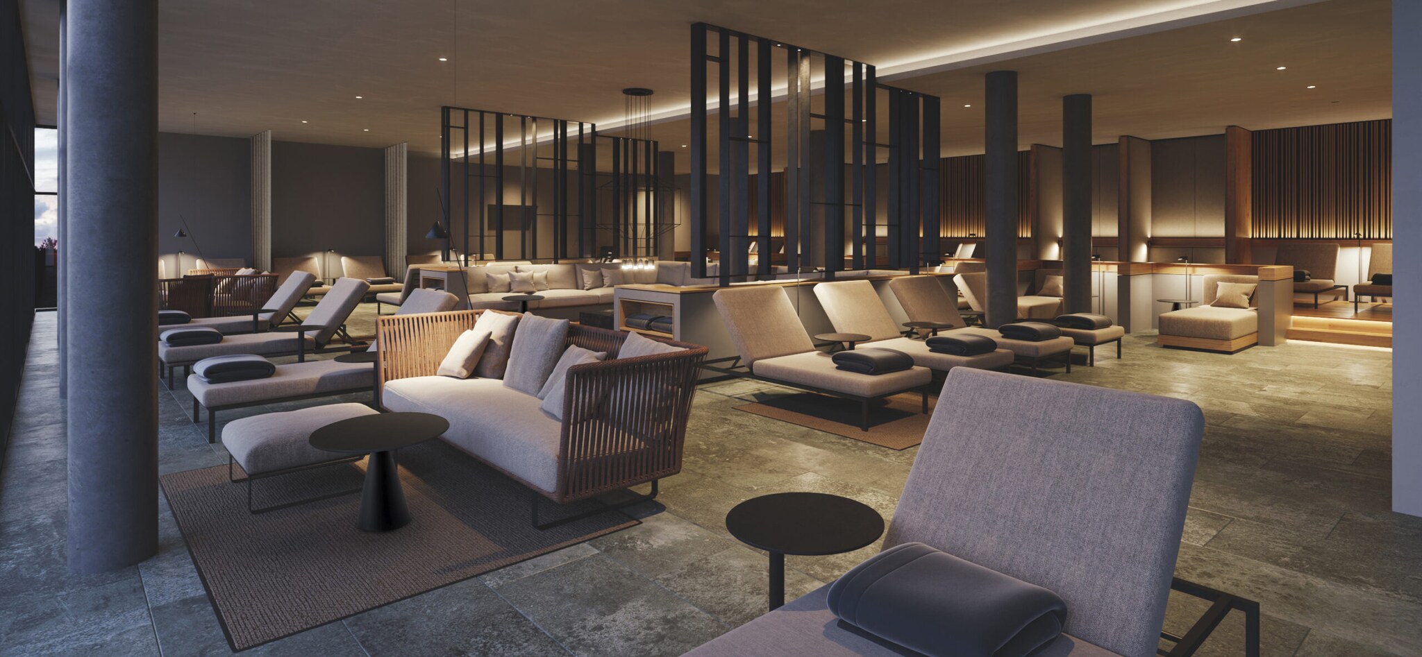 Lounge mit Sofas und Liegen in warmen Brauntönen