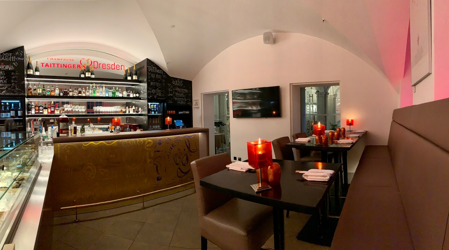 Austernbar mit Ledersitzen und einer illuminierten Theke