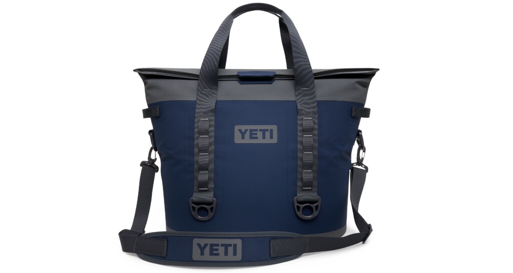 Eine dunkelblaue Kühltasche mit grauen Details und Tragegurten in Form eines Shoppers