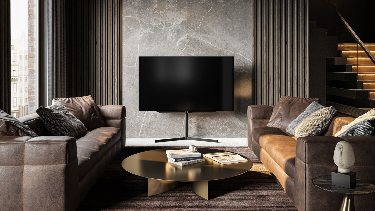 Ein Loewe-Fernseher in einem stilvoll eingerichteten Wohnzimmer.