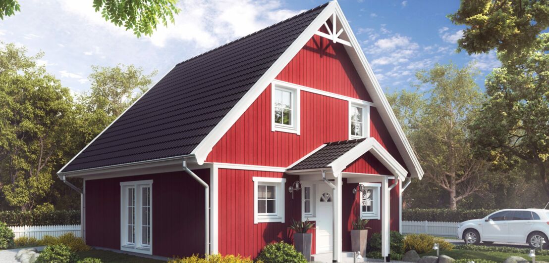 Ein freistehendes, rotes Einfamilienhaus aus Holz im schwedischen Stil