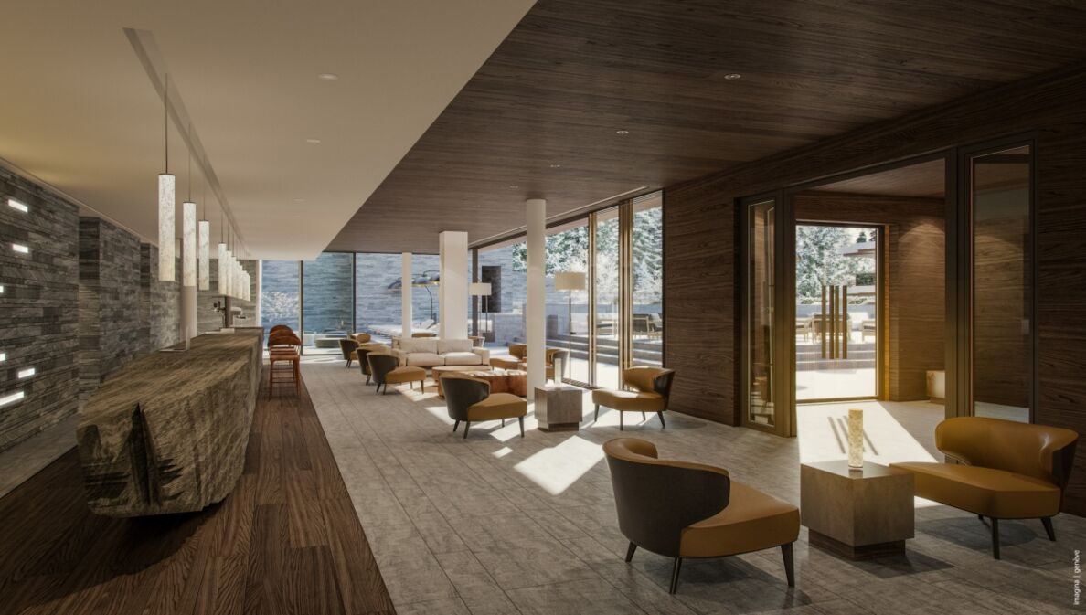 Elegante Hotellobby mit Designermöbeln und Ausblick auf eine Winterlandschaft