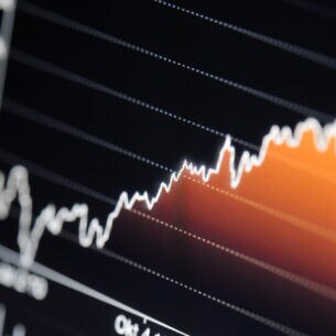 Ein schwarzes Diagramm mit einer roten Kurve, die nach oben geht