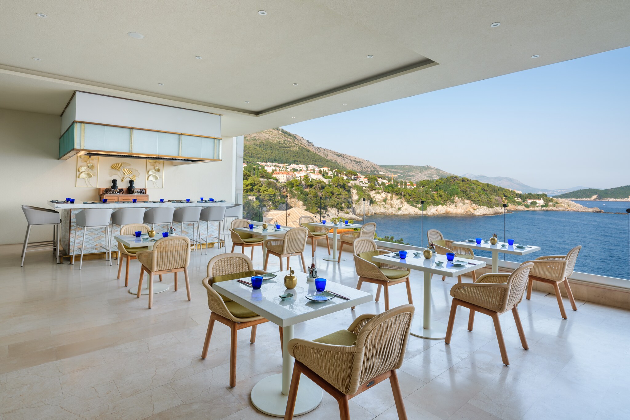 The Umi Teppanyaki restaurant is full of small tables and wicker chairs, and open on one wall to reveal a view over the Adriatic Sea.