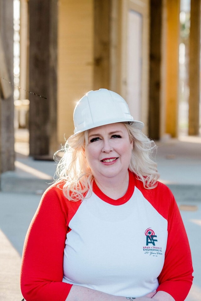Headshot of Small Business Owner Chandra Womack with a construction helmet on
