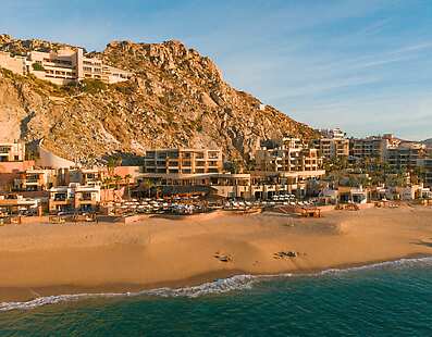 Aerial Photo of the resort, with the Pacific Ocean in the foreground. 