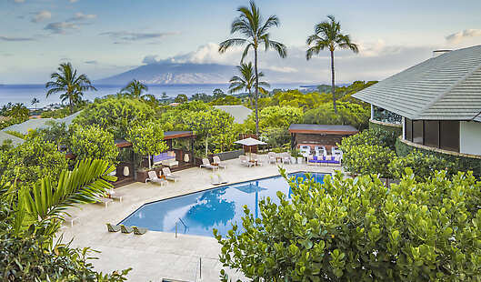 The iconic pool and cabanas at Hotel Wailea