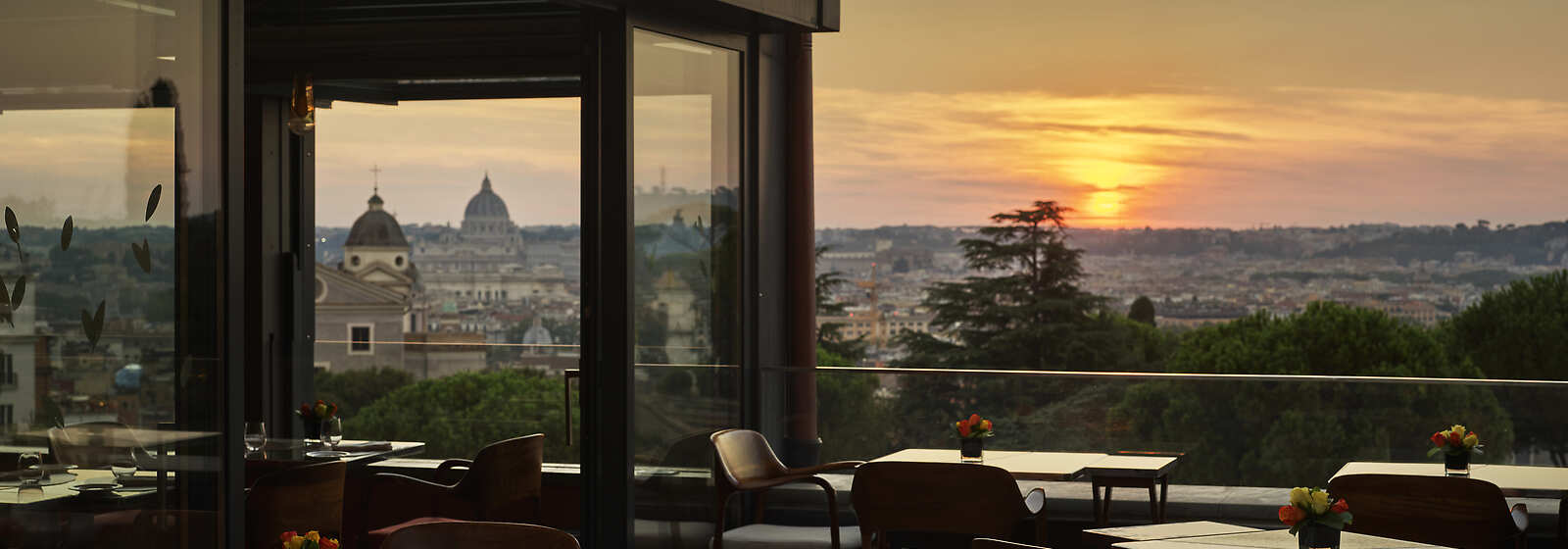 Hotel Eden's Il Giardino Ristorante Open air terrace during sunset by Dorchester Collection
