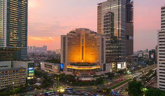 Grand Hyatt Jakarta's exterior shot during sunset hours. 