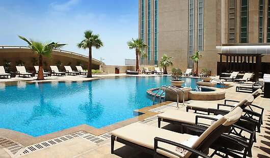 A gentle breeze and proud palm trees conjur up an oasis scene from the Arabian desert. Ensconce to the immaculate swimming pool. Linger on a