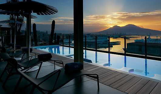 The exclusive view over the Bay and the Mt. Vesuvius from our rooftop pool