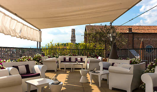 The Due Torri Hotel hosts the only rooftop panoramic terrace of the city, seasonal opening