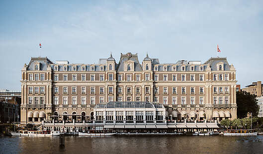 The iconic InterContinental Amstel Amsterdam, along the Amstel River banks.