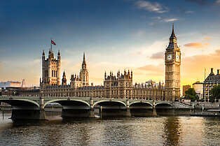 Aerial View of Big Ben and the Palace of Westminster along the Thames River in London, England.