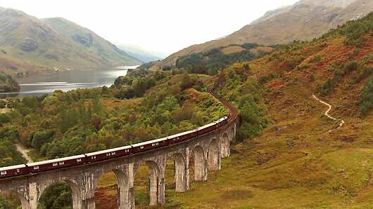 The Royal Scotsman travelling across Glenfinnan Viaduct