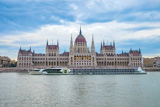 Tauck Riverboat the ms Savor on the Danube under Budapest's Parliament. 