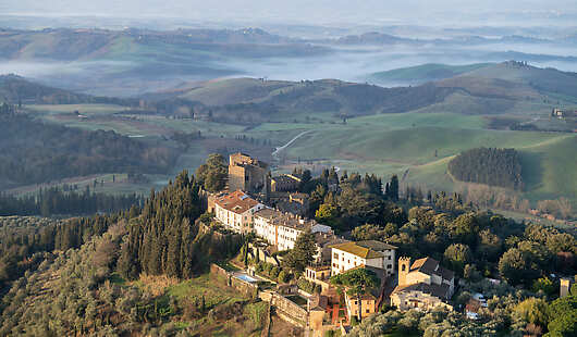 An aerial shot of Castelfalfi village and the surrounding owned estate.