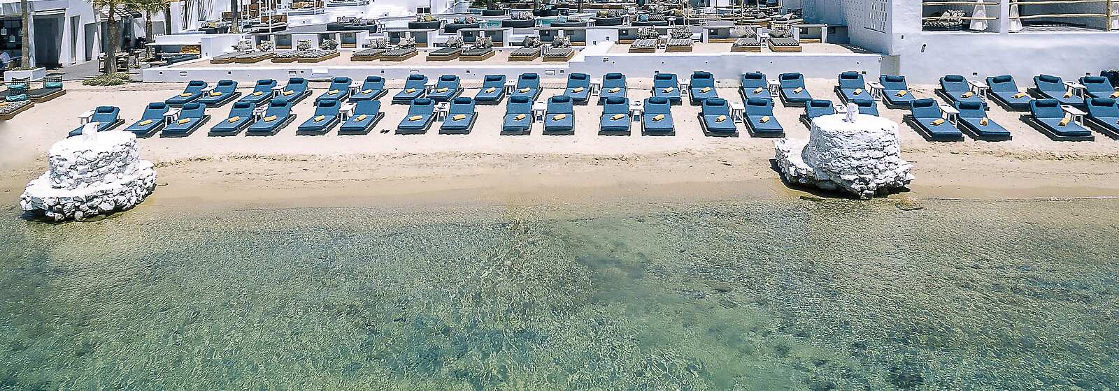 aerial view of Mykonos Blanc featuring the main building, pool and beach