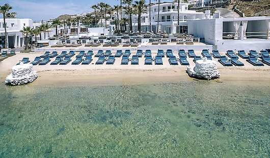 aerial view of Mykonos Blanc featuring the main building, pool and beach