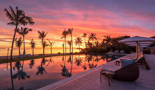 Sunset over the main pool at Tovolea Restaurant