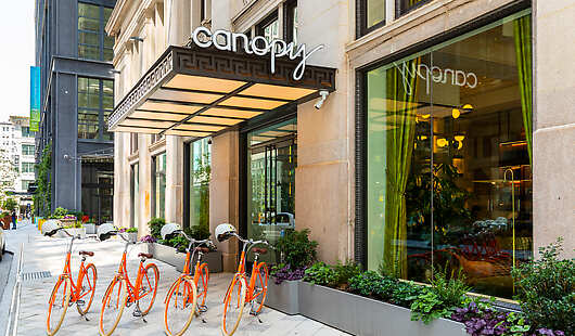 This is the main entrance of the hotel featuring the Canopy bicycles available to borrowed complimentary to our guests. 