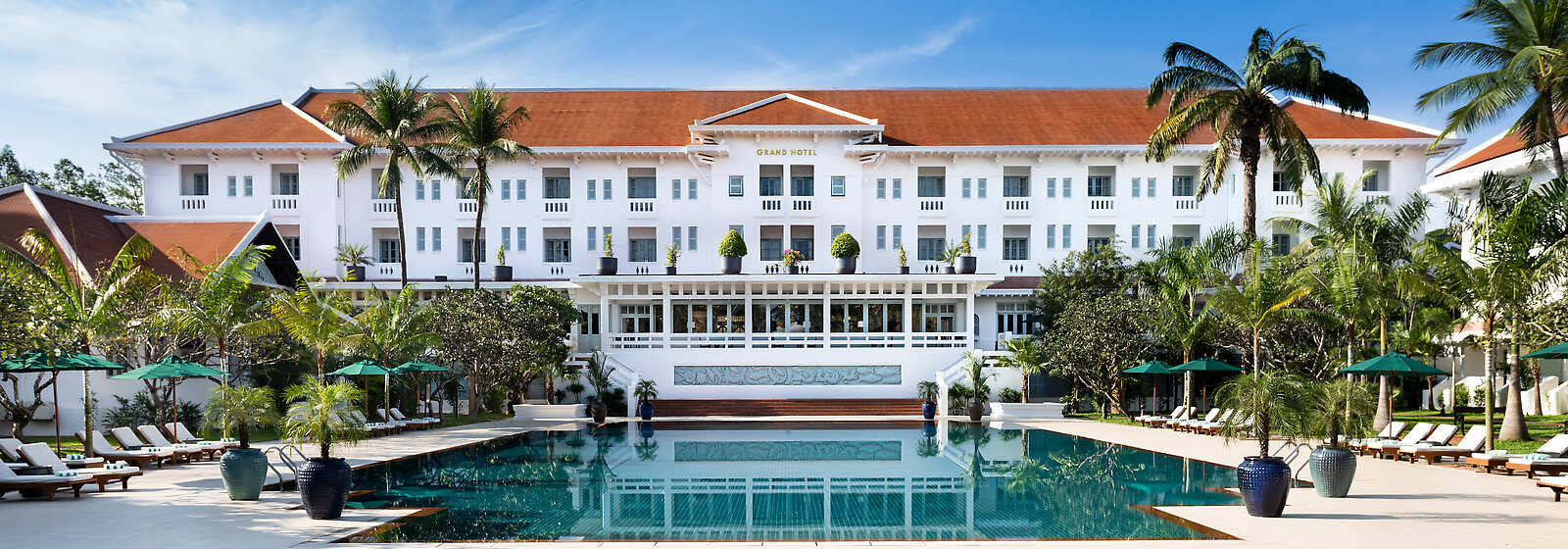Exterior of hotel with view of pool