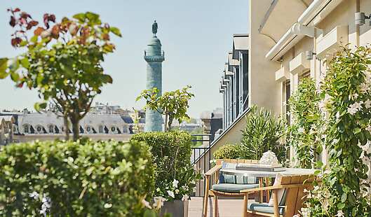 The Vendôme Suite offers a spectacular 60-square-meter private balcony overlooking Rue de la Paix and the Vendôme column.