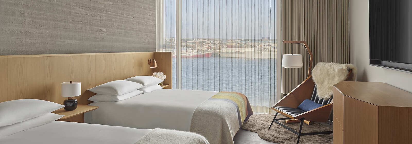 Our sophisticated Deluxe rooms are overlooking the Reykjavik Harbor and are available with King beds and Double beds.