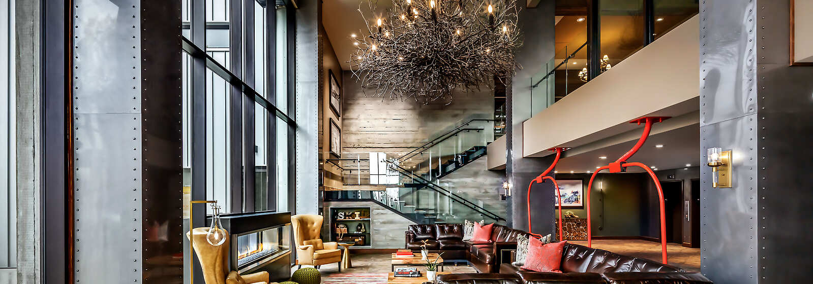 The lobby welcomes guests with floor to ceiling windows, bringing the outside in. 