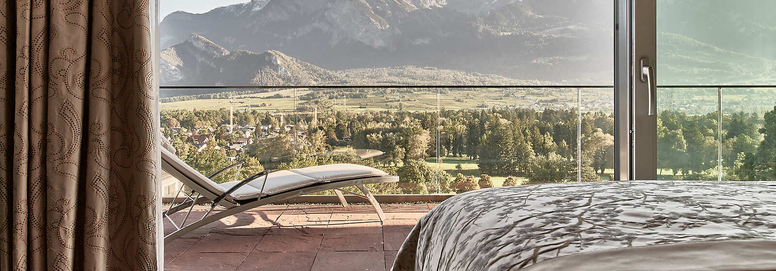 Penthouse Suite Bedroom with amazing views over the golf course and the beautiful Heidi mountain in the background