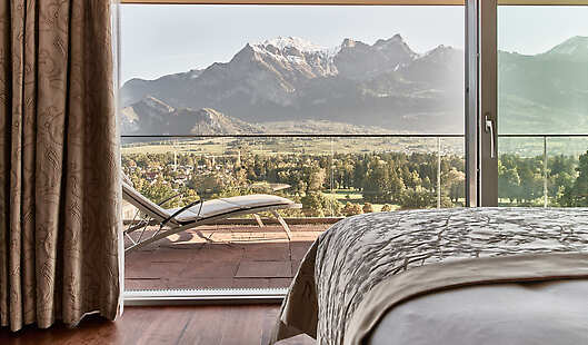 Penthouse Suite Bedroom with amazing views over the golf course and the beautiful Heidi mountain in the background