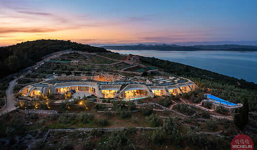 Exterior night photo of hotel