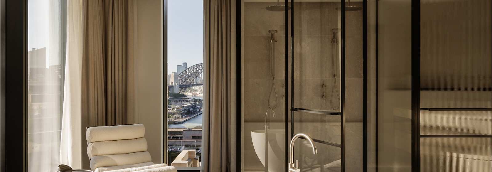 Liberty Suite - Expansive loft-style floorplan, floor-to-ceiling windows framing cityscape views and harbour glimpses.