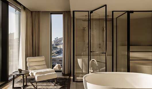 Liberty Suite - Expansive loft-style floorplan, floor-to-ceiling windows framing cityscape views and harbour glimpses.