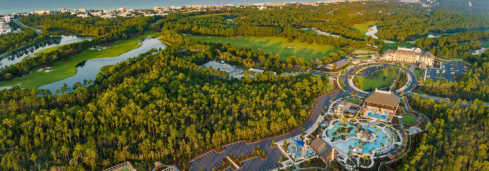 Aerial view of Camp Creek Inn, Camp Creek Golf Course, and the Camp Creek wellness amenities.