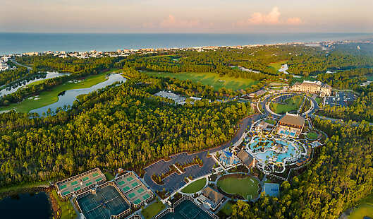 Aerial view of Camp Creek Inn, Camp Creek Golf Course, and the Camp Creek wellness amenities.