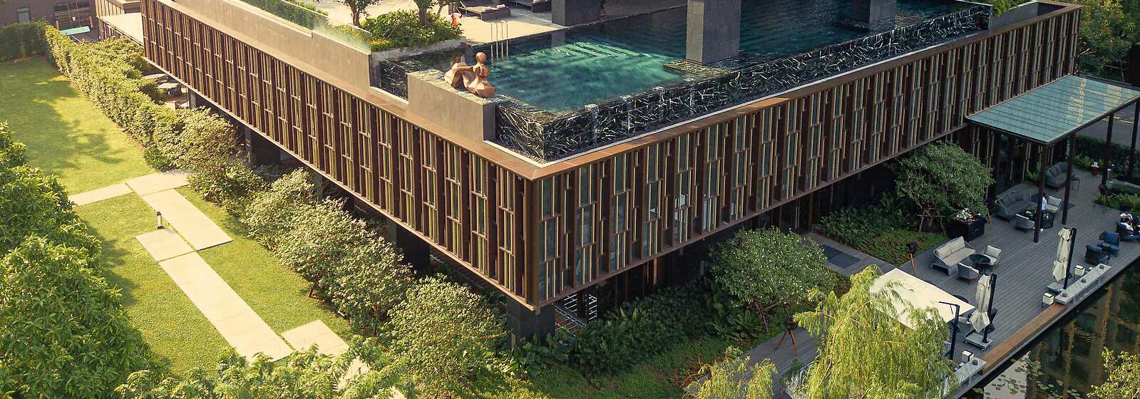 Soak up the sun at the outdoor infinity pool nestled in Kimpton Maa-Lai Bangkok’s secret garden.
