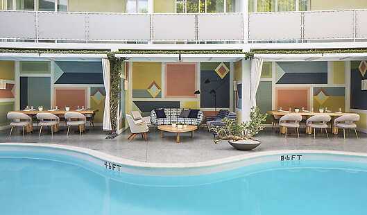 Outdoor heated pool with private cabanas 