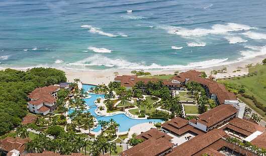 Overview of the JW Marriott Guanacaste Ocean Front resort and Playa Mansita overlooking the pacific ocean. 