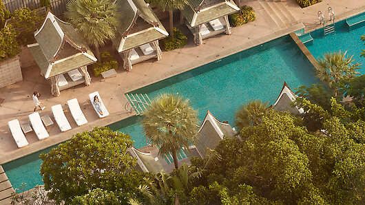Find you happy place at the poolside of this tranquil resort, where relaxation and bliss unite.